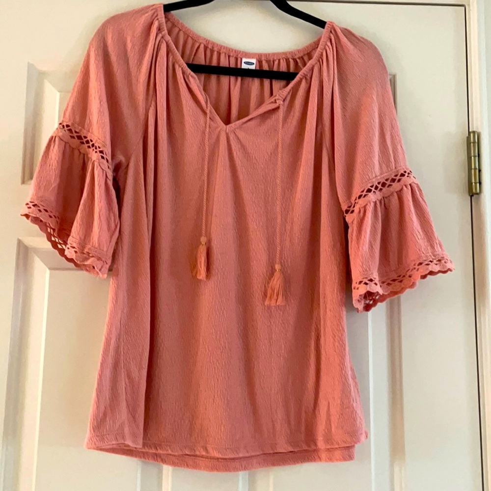 Soft pink just below the elbow top